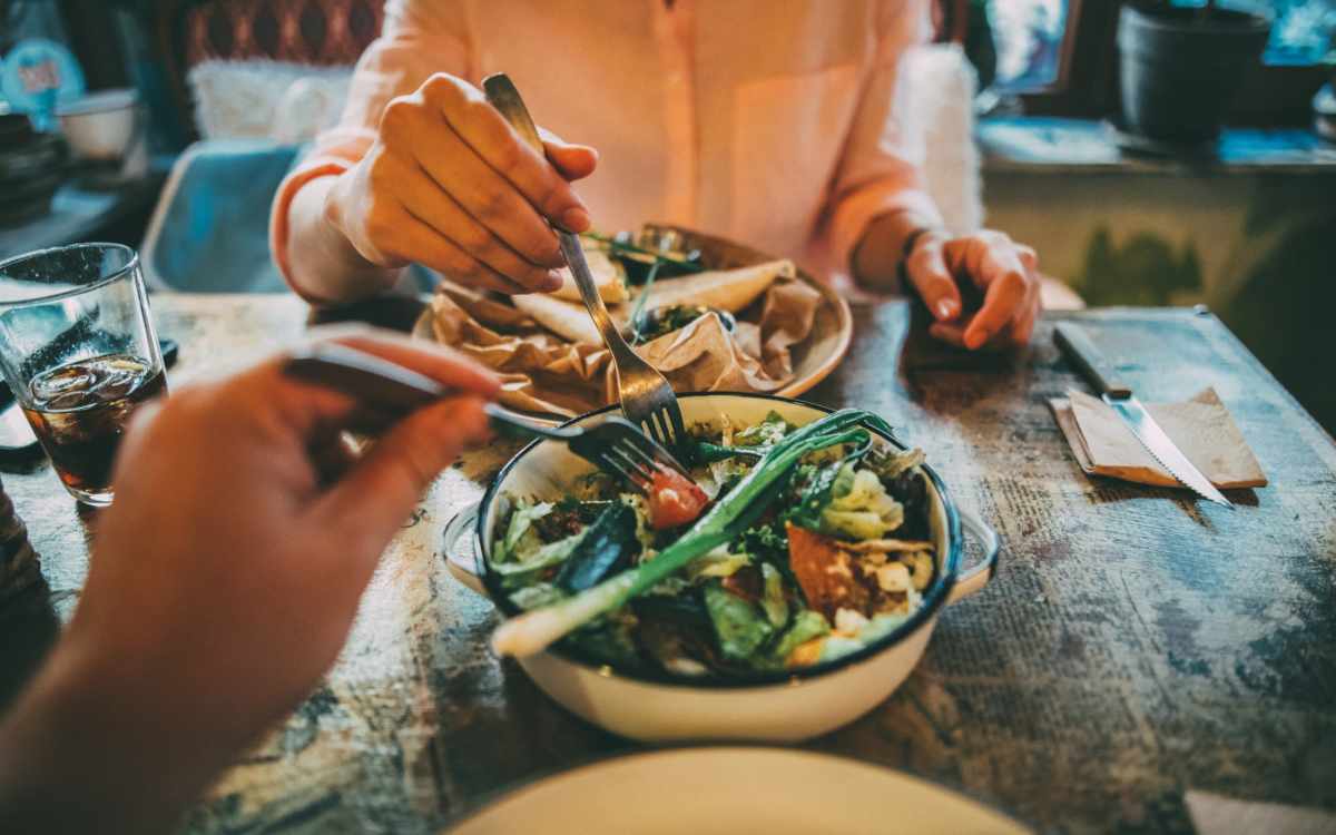 Two residents having a healthy salad at a local restaurant near Kirman Garden in Reno, Nevada