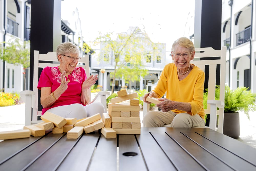 Residents playing dominoes at The Blake at Miramar Beach in Miramar Beach, Florida