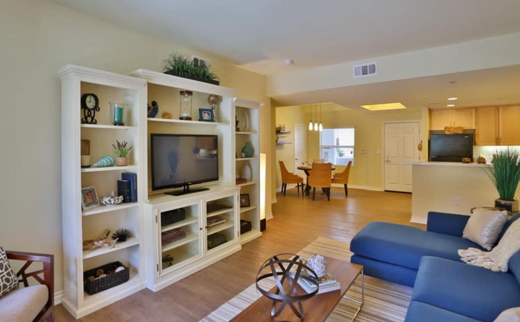 Well-decorated living area in a model home's open-concept floor plan at IMT Park Encino in Encino, California