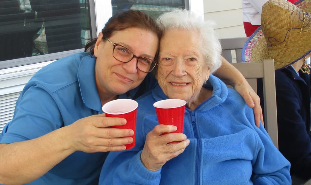 A resident and staff member hanging out at Grace Point Place in Oak Lawn, Illinois. 