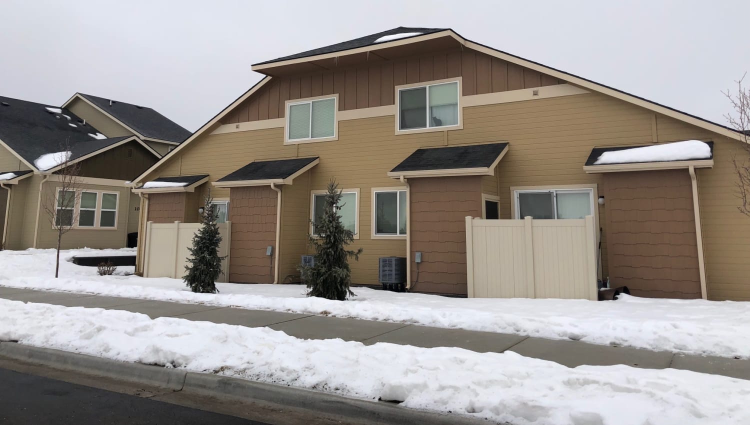 Exterior with snow at Cedar Park & Canyon Falls Townhomes in Twin Falls, Idaho