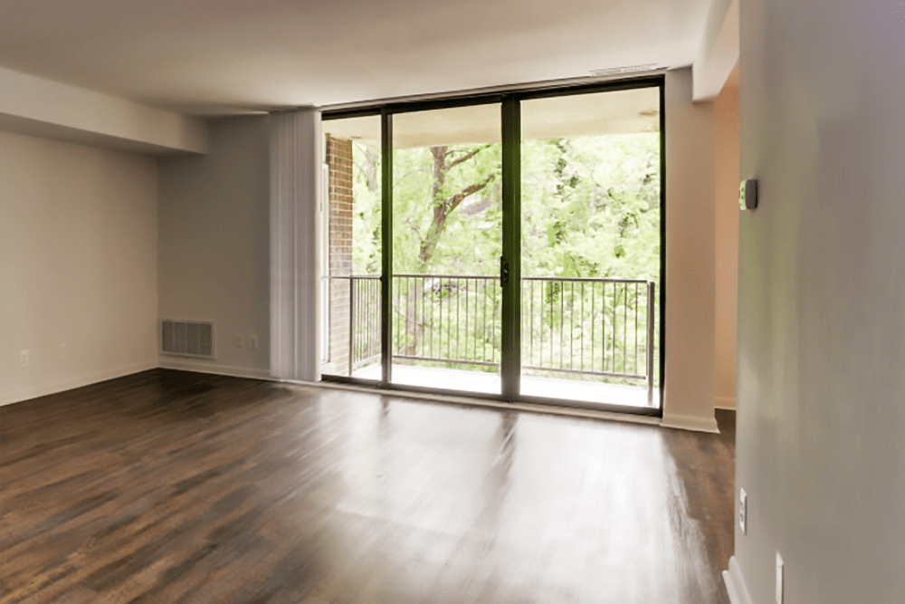 Plank flooring and door to balcony at Hampton Manor Apartments and Townhomes in Cockeysville, Maryland