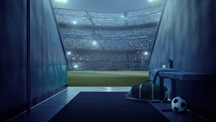 View into a soccer stadium from the players’ zone