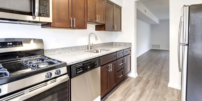 Model kitchen with wood flooring at Hampton Manor Apartments and Townhomes in Cockeysville, Maryland