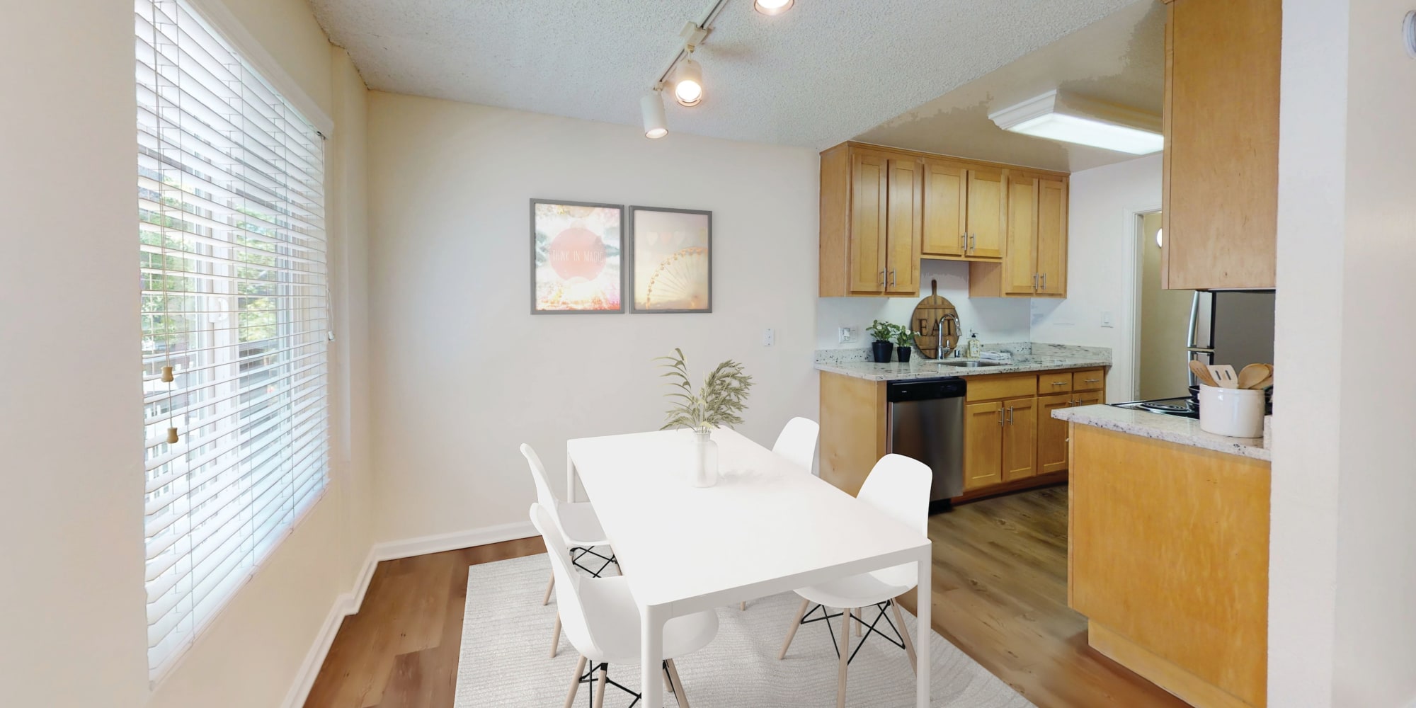 Dining nook and kitchen in a model apartment at Pleasanton Glen Apartment Homes in Pleasanton, California