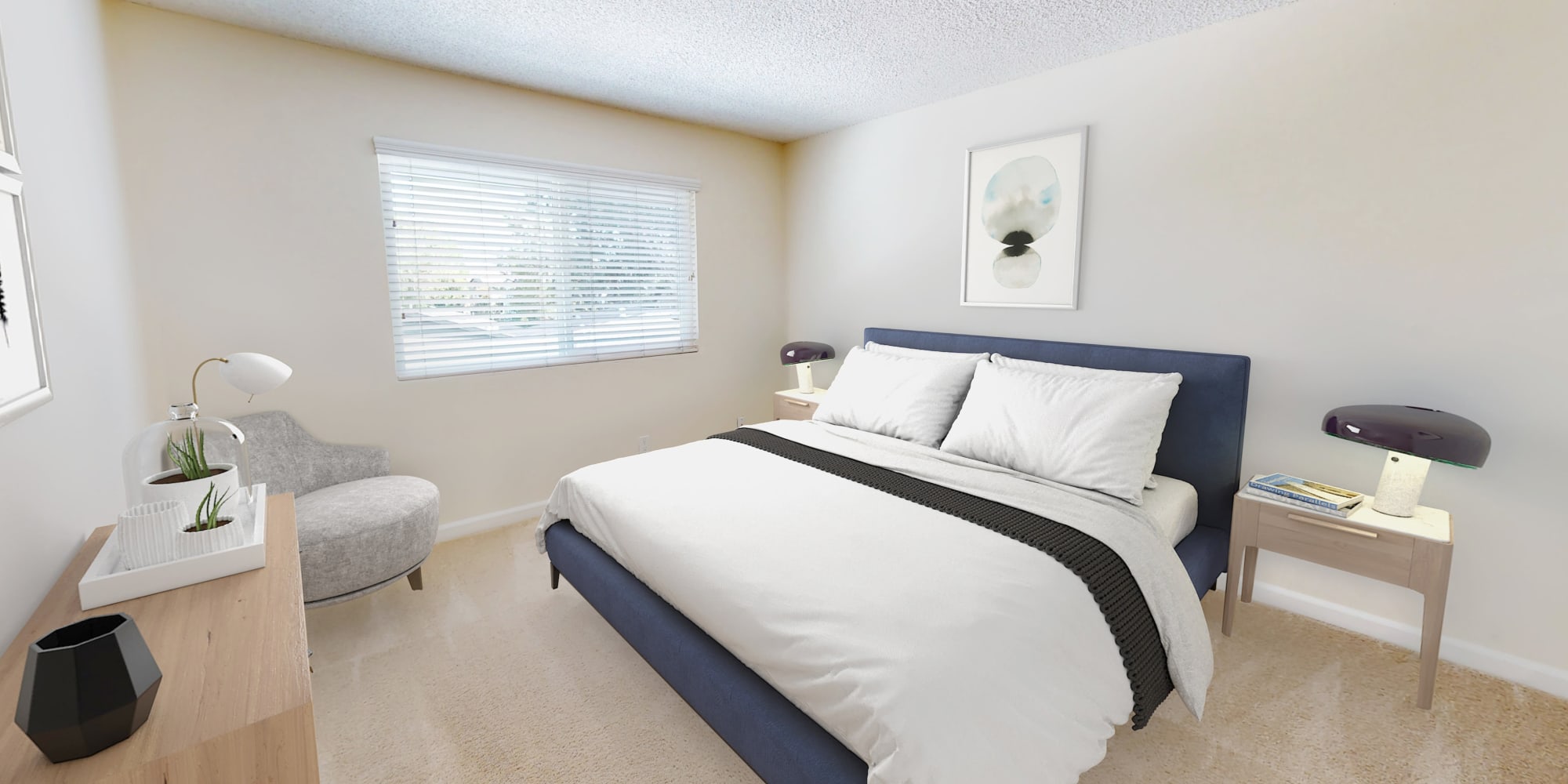 Primary bedroom suite of a model home at Pleasanton Glen Apartment Homes in Pleasanton, CA