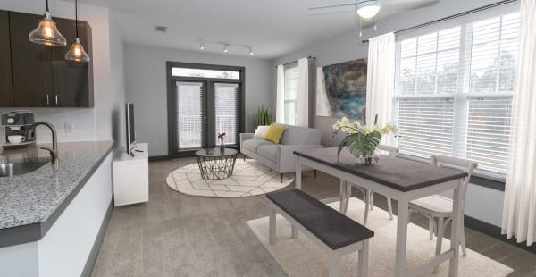 Living room and dining area in an apartment at Gibson Flowery Branch in Flowery Branch, Georgia