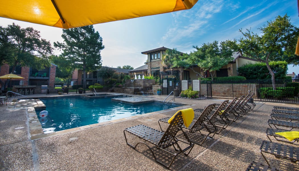 Shaded seating near the pool at Grayson Ridge in North Richland Hills, Texas