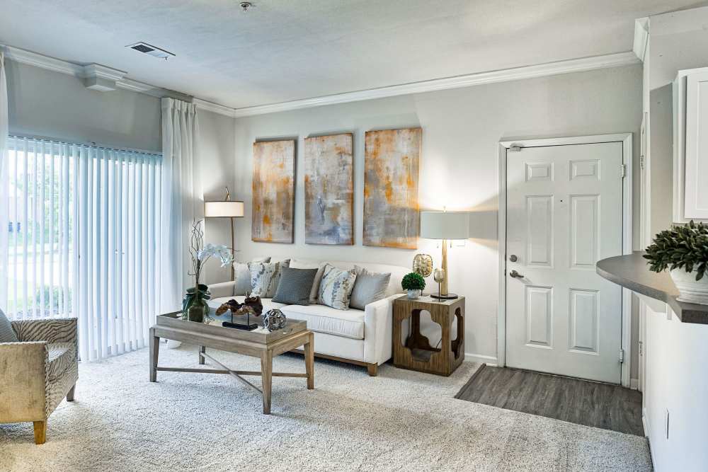 Living room with a couch and a coffee table at Eastland Trails in Independence, Missouri