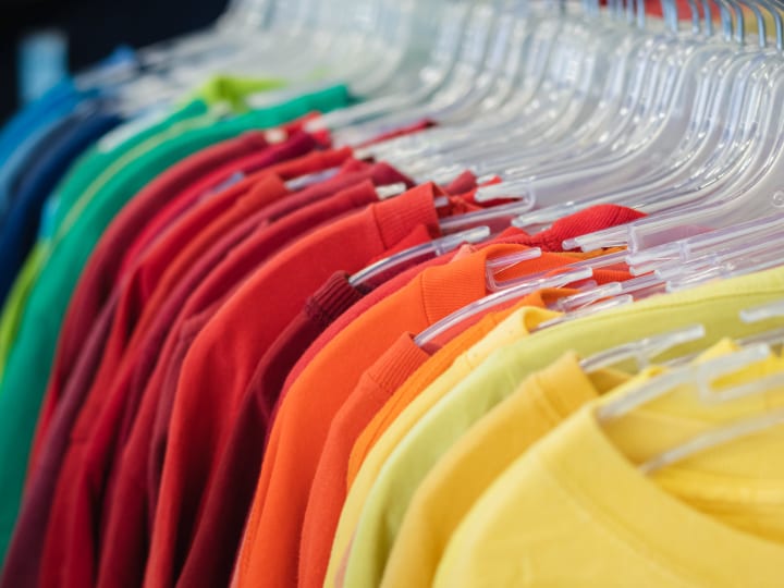 color coordinated t-shirts on hangers