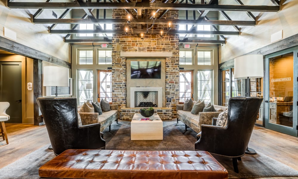 Interior clubhouse with fireplace and seating area at Rivertop Apartments in Nashville, Tennessee