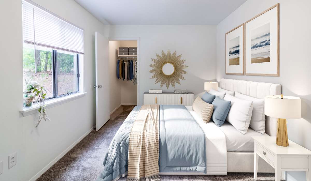 Bedroom with view of outside at Tanglewood Apartments in Southern Pines, North Carolina