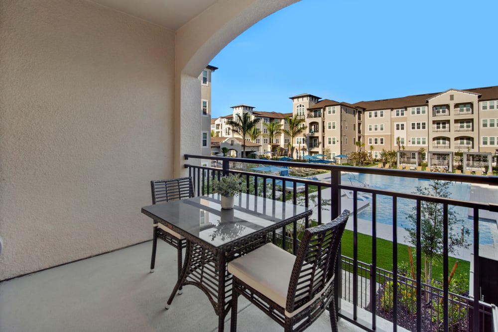 Private resident patio with stunning views at Murano at Three Oaks in Fort Myers, Florida
