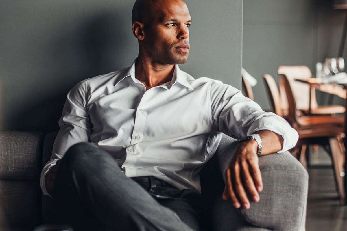 Businessman sitting on a comfortable couch at The Kendry in Charlotte, North Carolina