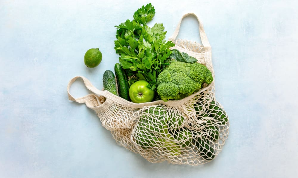 Reusable produce bag fulled with fresh vegetables at The Buckler in Milwaukee, Wisconsin