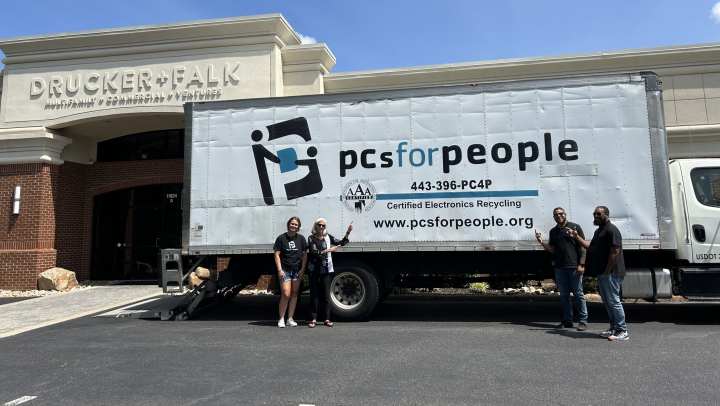 Employers posing with the equipment truck