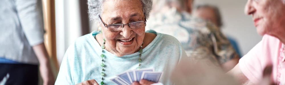 Residents playing cards together at Transitions At Home - Central in Stevens Point, Wisconsin