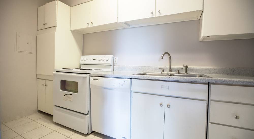 A kitchen room with white colored features at Central Gardens in Memphis, Tennessee