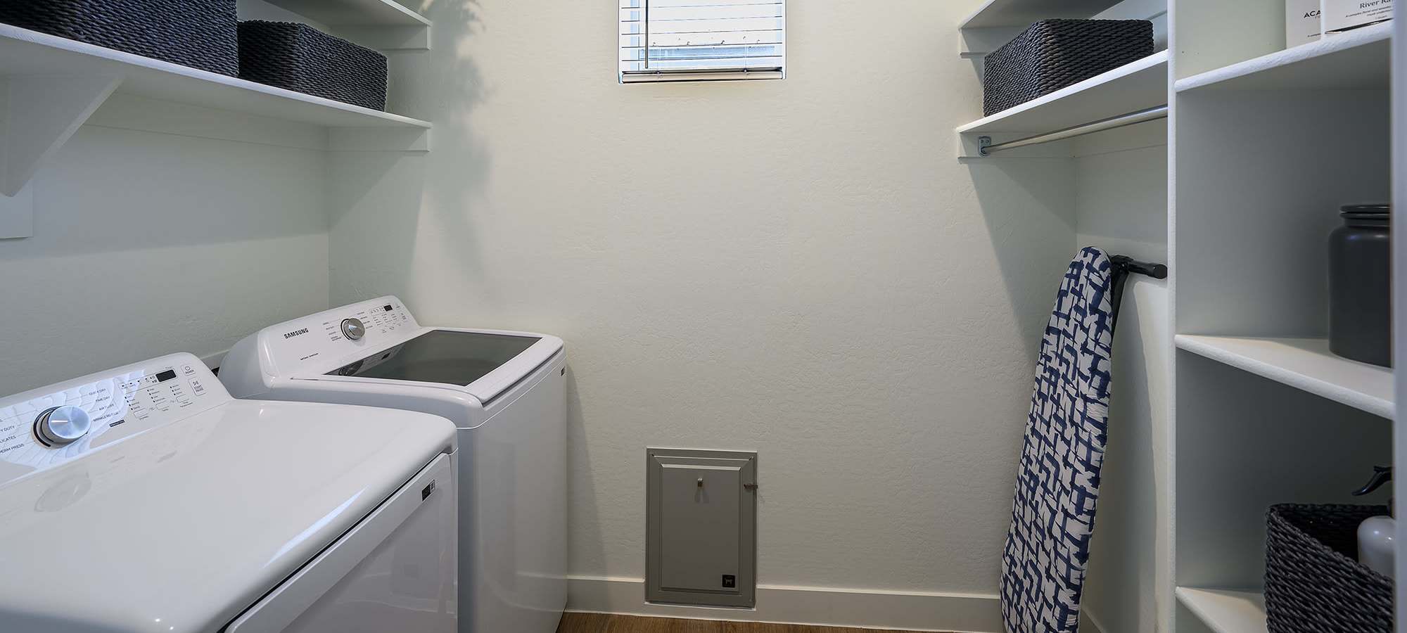 Spacious Laundry Room with Doggy Door at FirstStreet Ballpark Village in Goodyear, Arizona