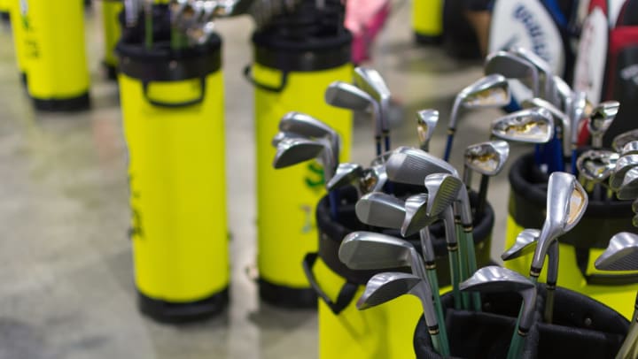 A variety of golf clubs in a golf shop