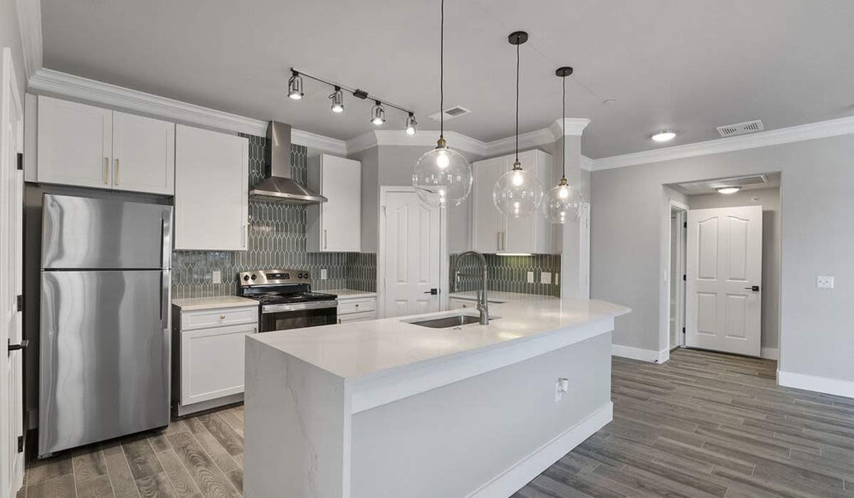 Kitchen with fridge at Seagrove in Conroe, Texas