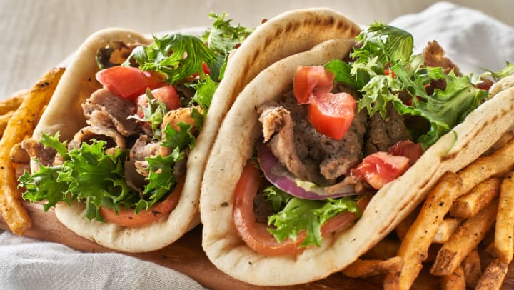 gyros with a side of fries on a plate | Greek food in Lantana