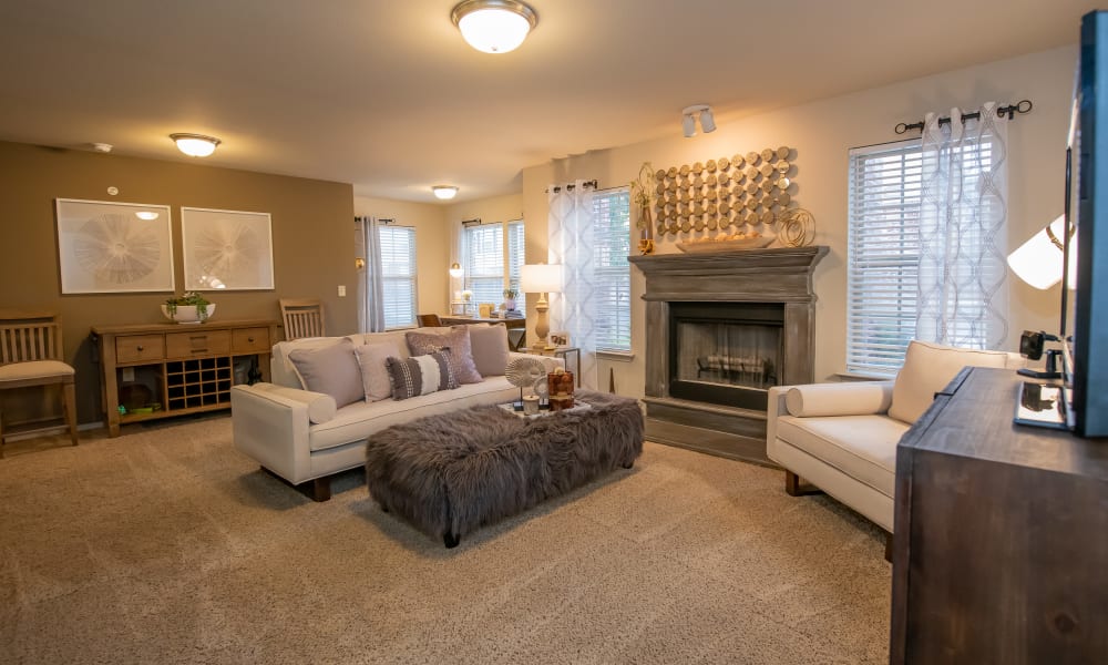 An apartment living room with fireplace at Cascata Apartments in Tulsa, Oklahoma