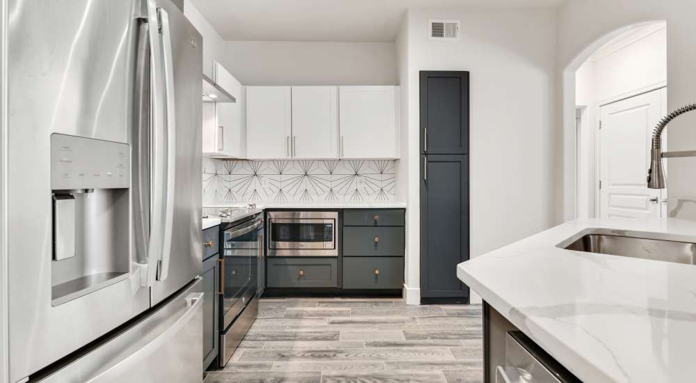 Specious kitchen with modern appliances at The Berkeley in Fort Worth, Texas