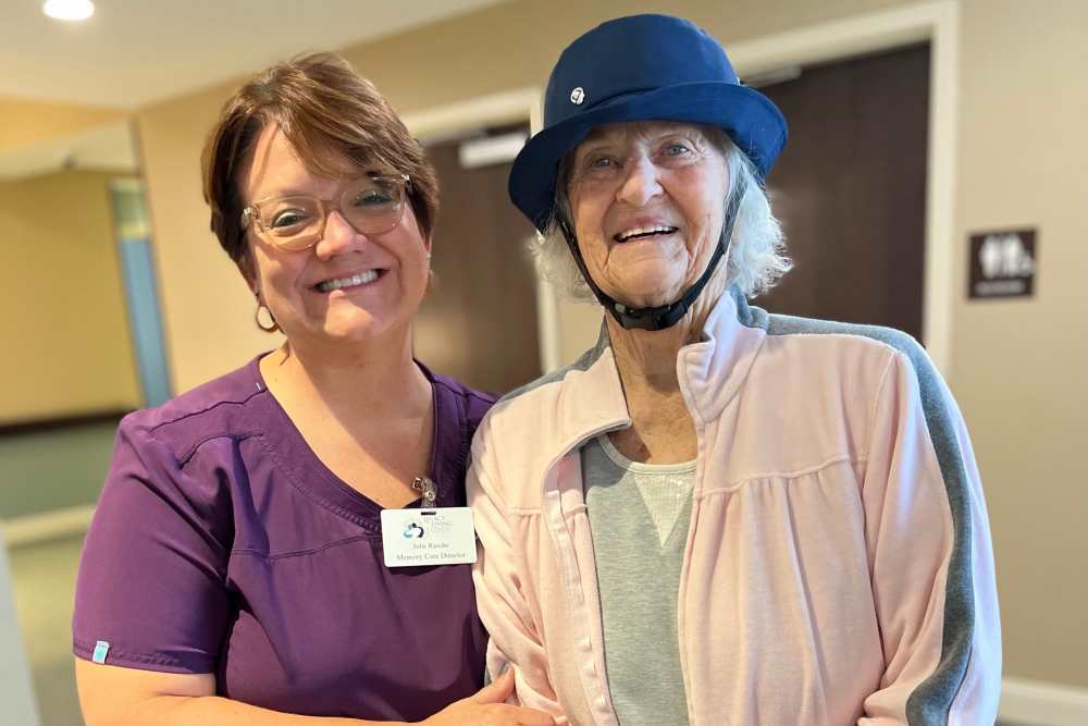 Resident with a nurse at Legacy Living Defiance in Defiance, Ohio