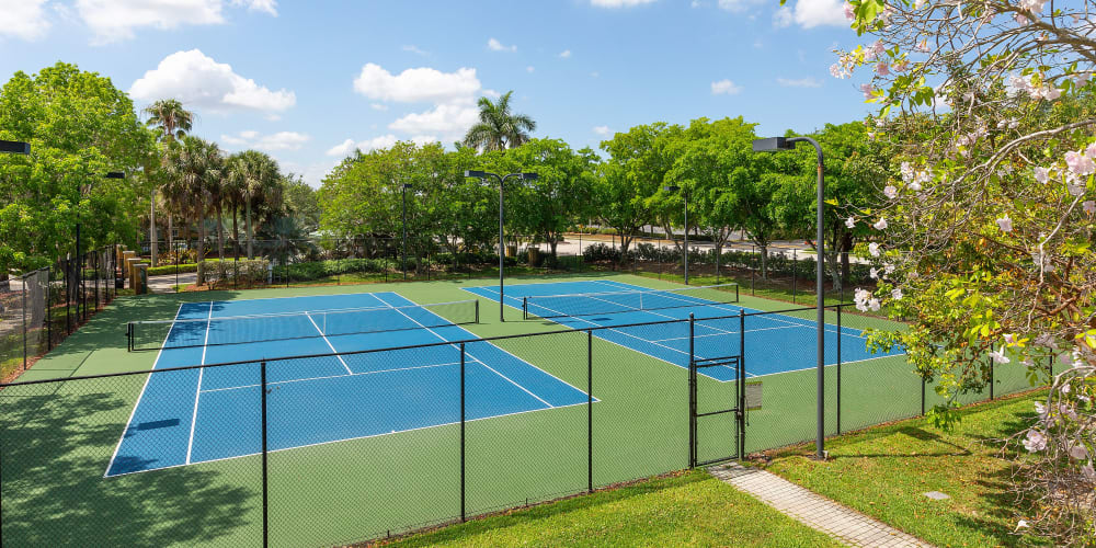 Tennis courts at Club Lake Pointe Apartments in Coral Springs, Florida