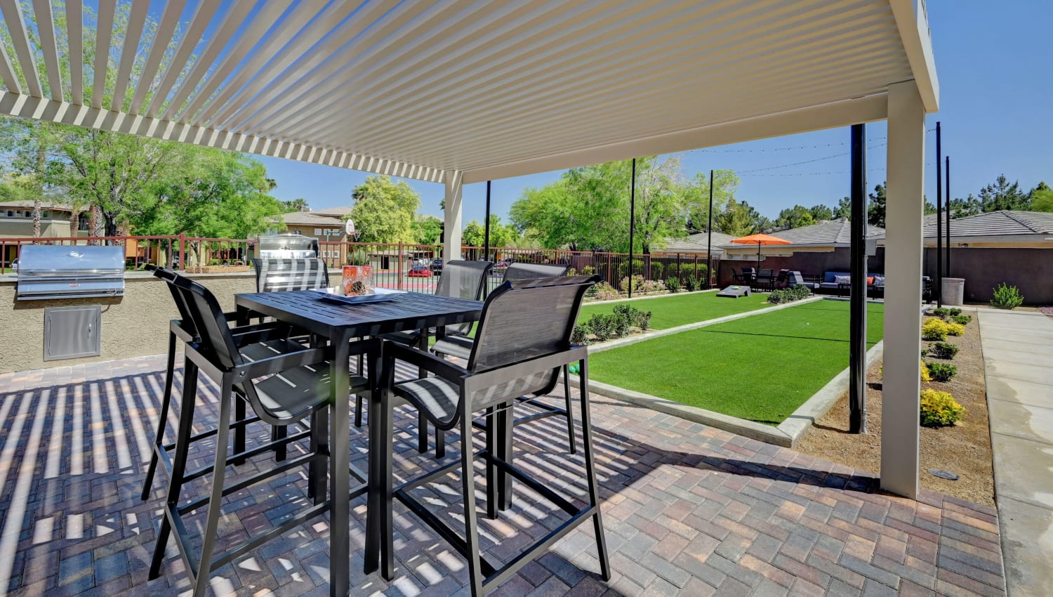 Outdoor seating and barbecues at Falling Water Apartments in Las Vegas, Nevada