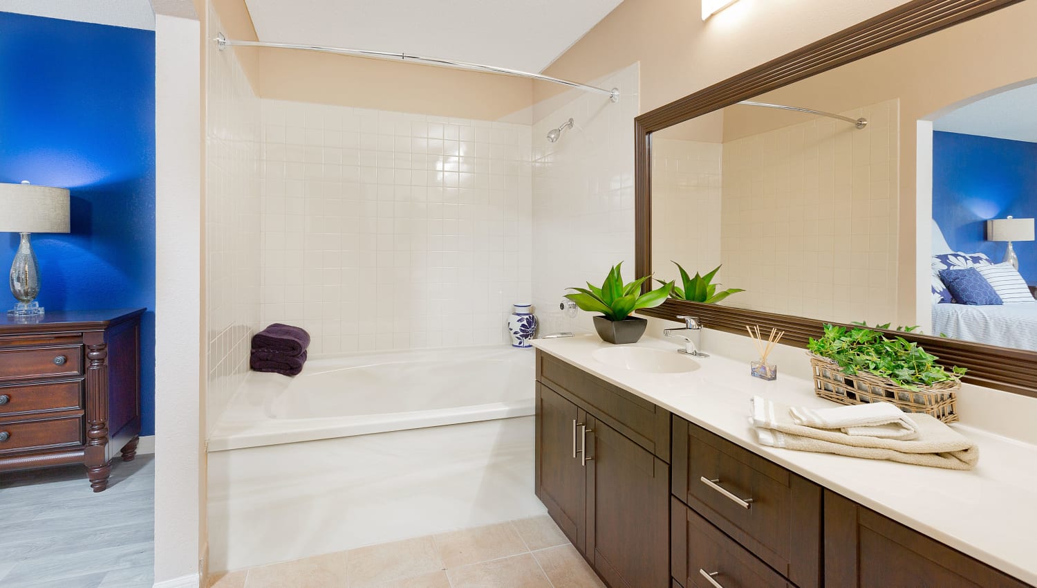 Primary bathroom with tub at Indian Hills Apartments in Boynton Beach, Florida