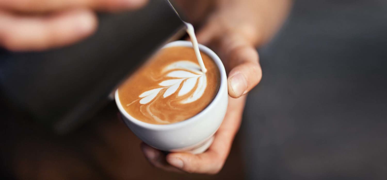 Making a latte at Olivers Trace Apartments in Winston Salem, North Carolina