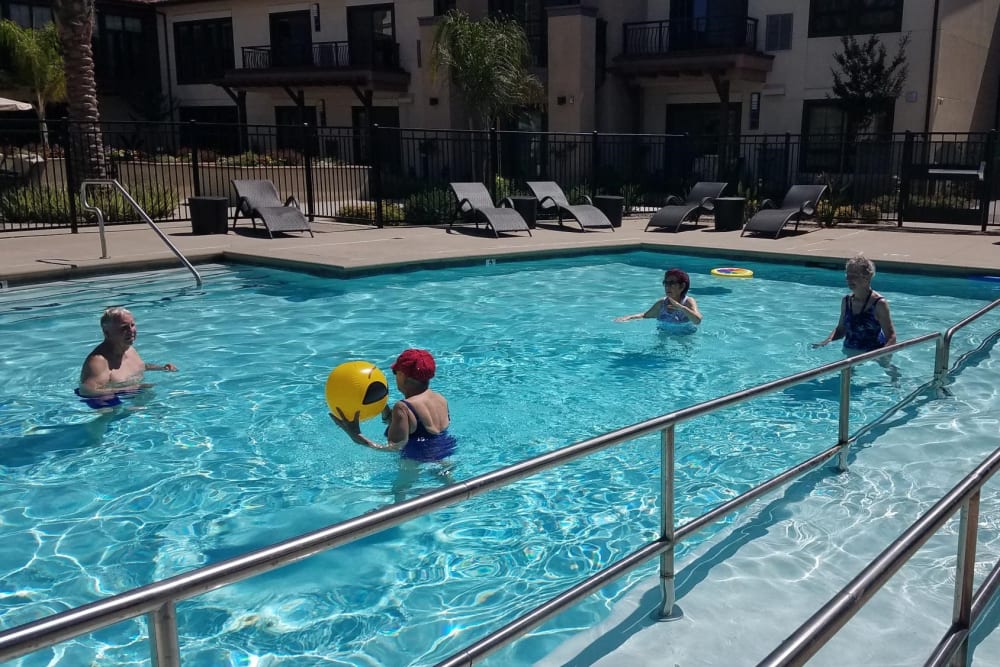 Residents enjoying the pool near Merrill Gardens at Rancho Cucamonga in Rancho Cucamonga, California. 