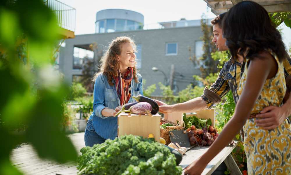 Residents buying veggies near Williston Pointe in Gainesville, Florida