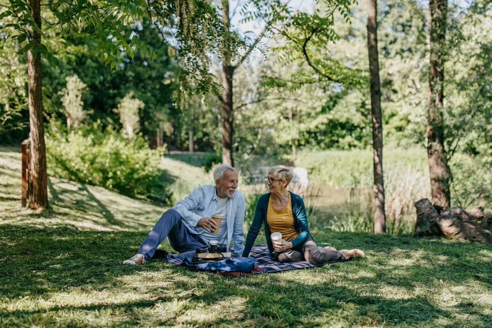 Resident couple habing a picnic at Village on the Park Oklahoma City in Oklahoma City, Oklahoma