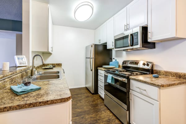 Kitchen layout in a model apartment home at Olive Ridge in Pomona, California