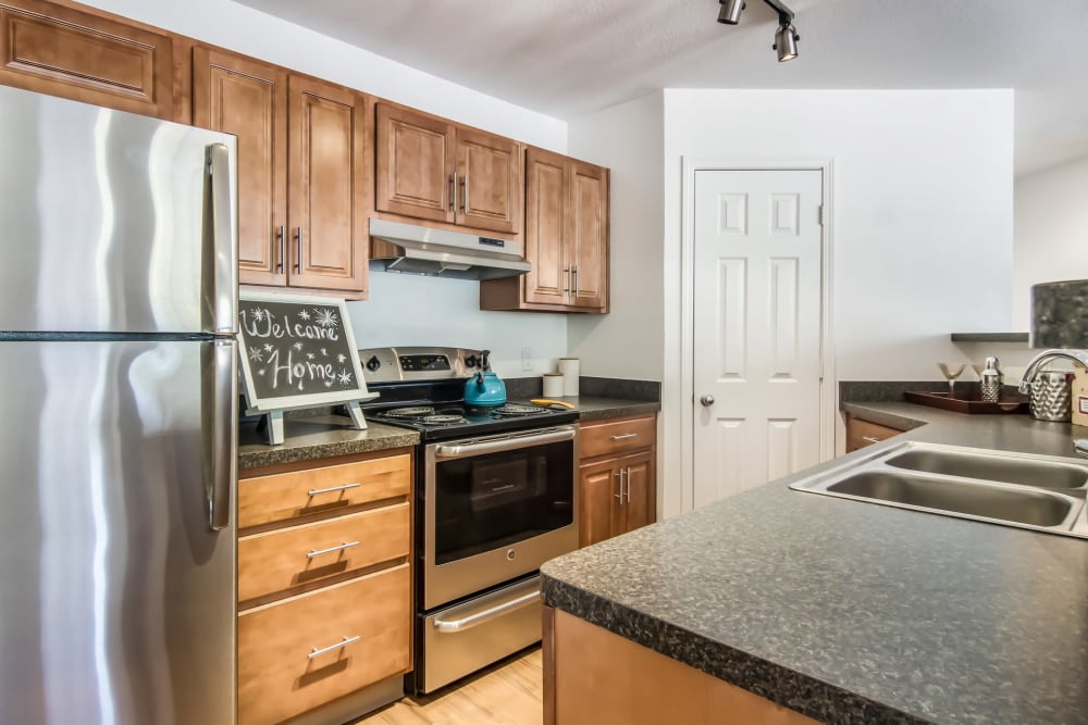 Open kitchen in model home at Cascade Falls Apartments in Akron, Ohio