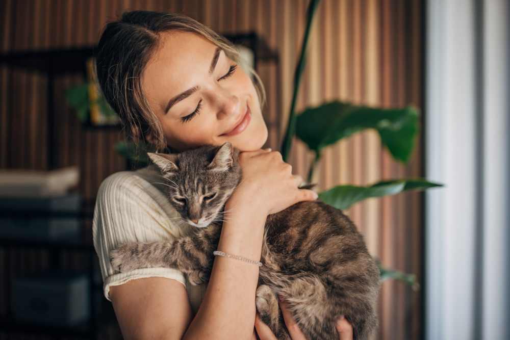 Woman with her cat in a model apartment at Martin Flats in Nashville, Tennessee
