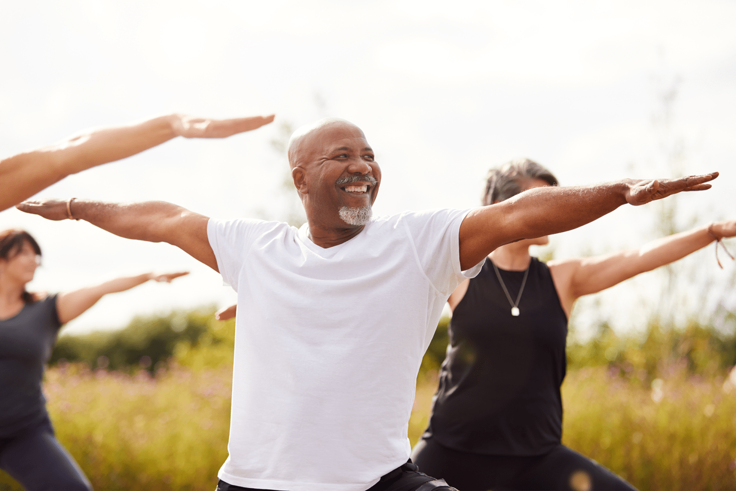 Residents doing yoga outdoors at Imperial Gardens Apartment Homes in Middletown, New York