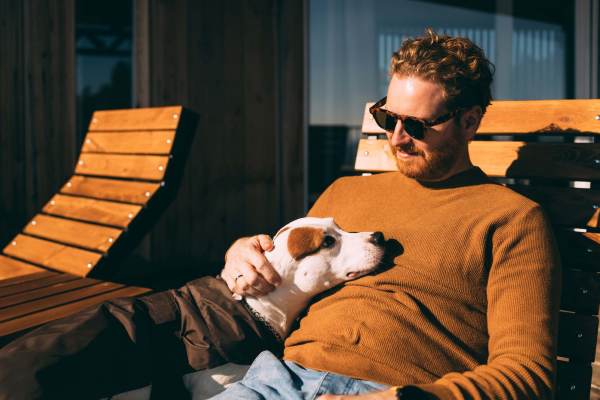 Man relaxing with dog on patio at 707 Leahy in Redwood City, California