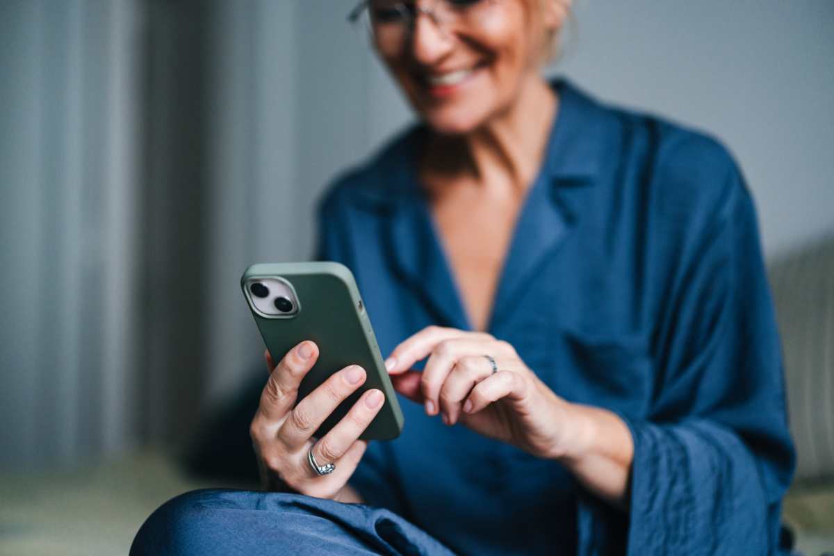 Resident on her phone at Butterfield Commons in Maricopa, Arizona