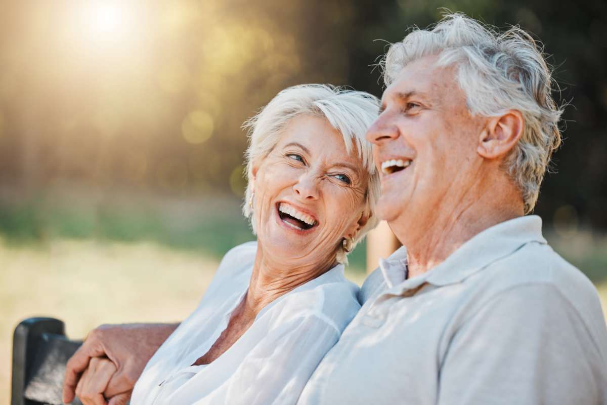 Elder couple sitting in the park at Villas At Meadow Springs in Ankeny, Iowa  
