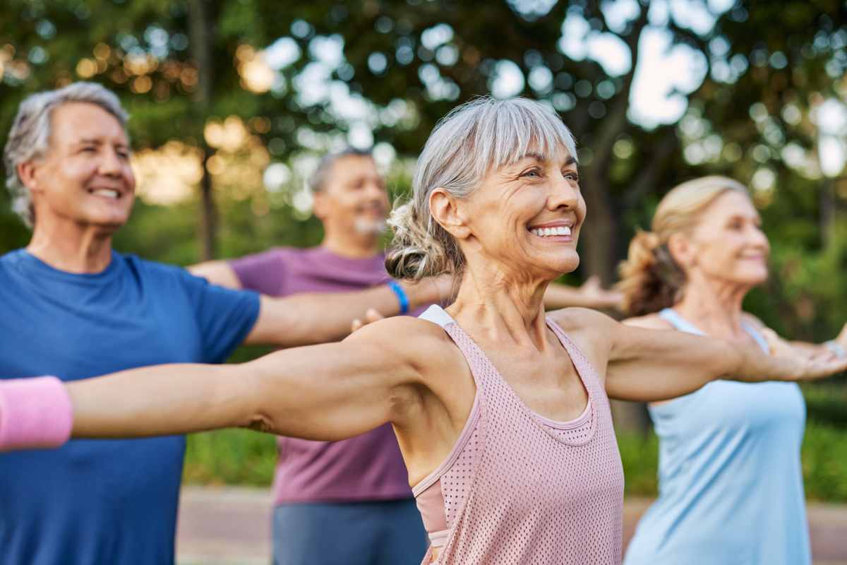 Resident in the park stretching with other residents near Corner House in Havre De Grace, Maryland