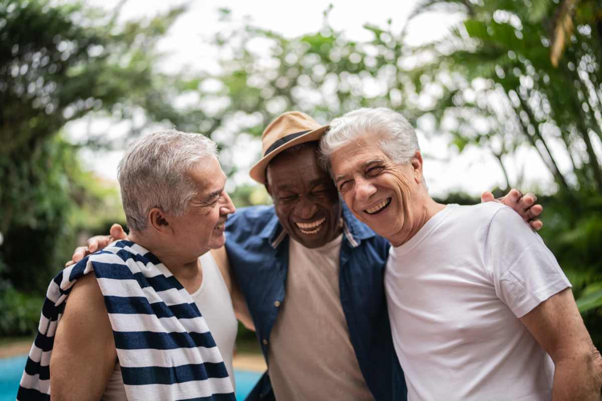 Group of residents laughing outside near Tiber Hudson in Ellicott City, Maryland           