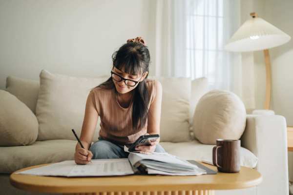 Women writing in a book at Raystone Apartments in Phoenix, Arizona