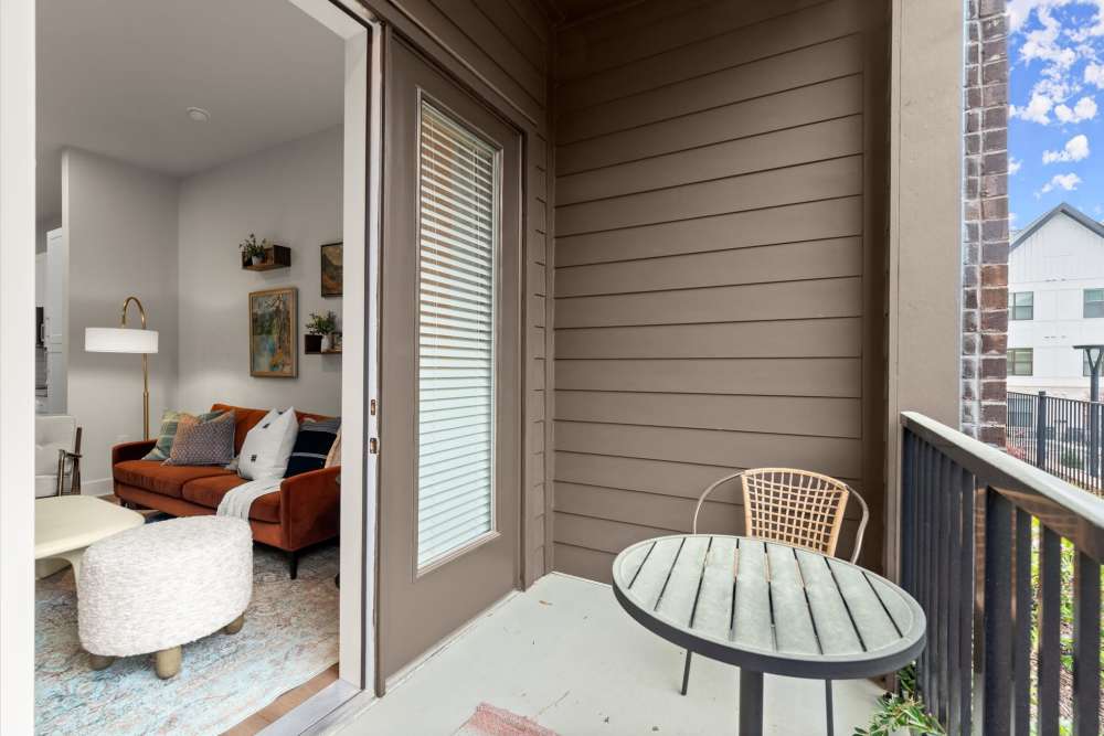 Living room and balcony at EVOQ East Cobb in Marietta, Georgia