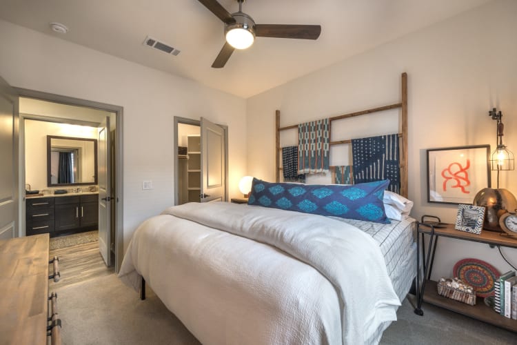 Furnished bedroom with large walk in closet at Mercantile River District in Fort Worth, Texas