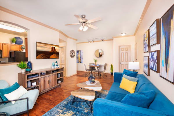 Spacious living room layout with autumn-toned furniture at Las Colinas at Black Canyon in Phoenix, Arizona