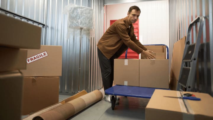 Man loading his storage unit at Downtown Self Storage Oregon